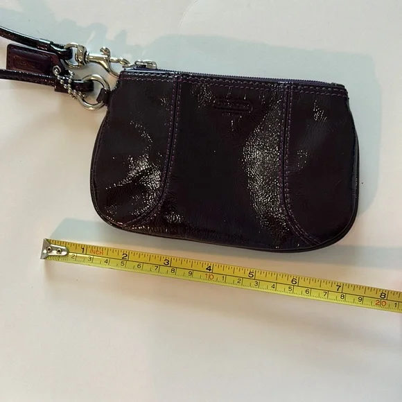 EUC Coach patent leather wristlet in dark purple or plum color and silver metal - Picture 10 of 10